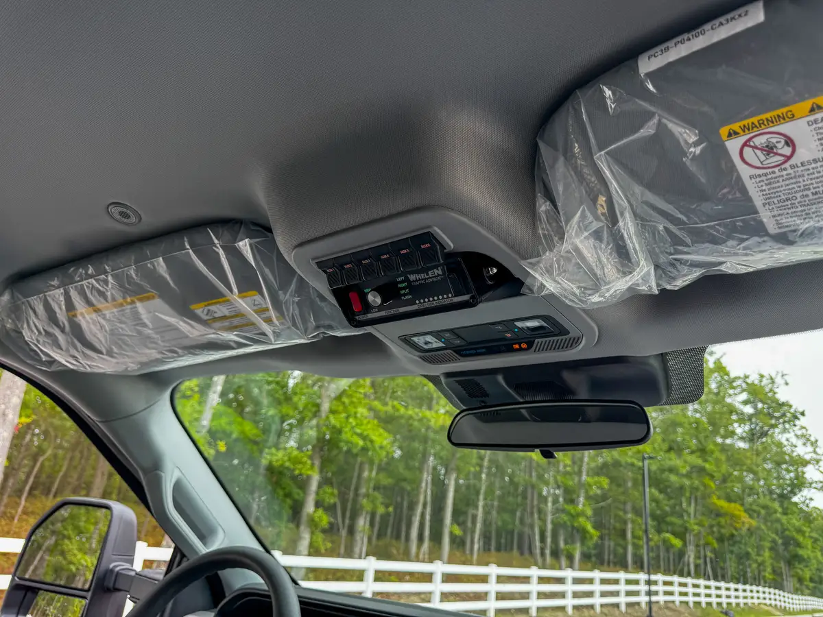Rear passenger door open view showing bench seat and crew-cab entry.